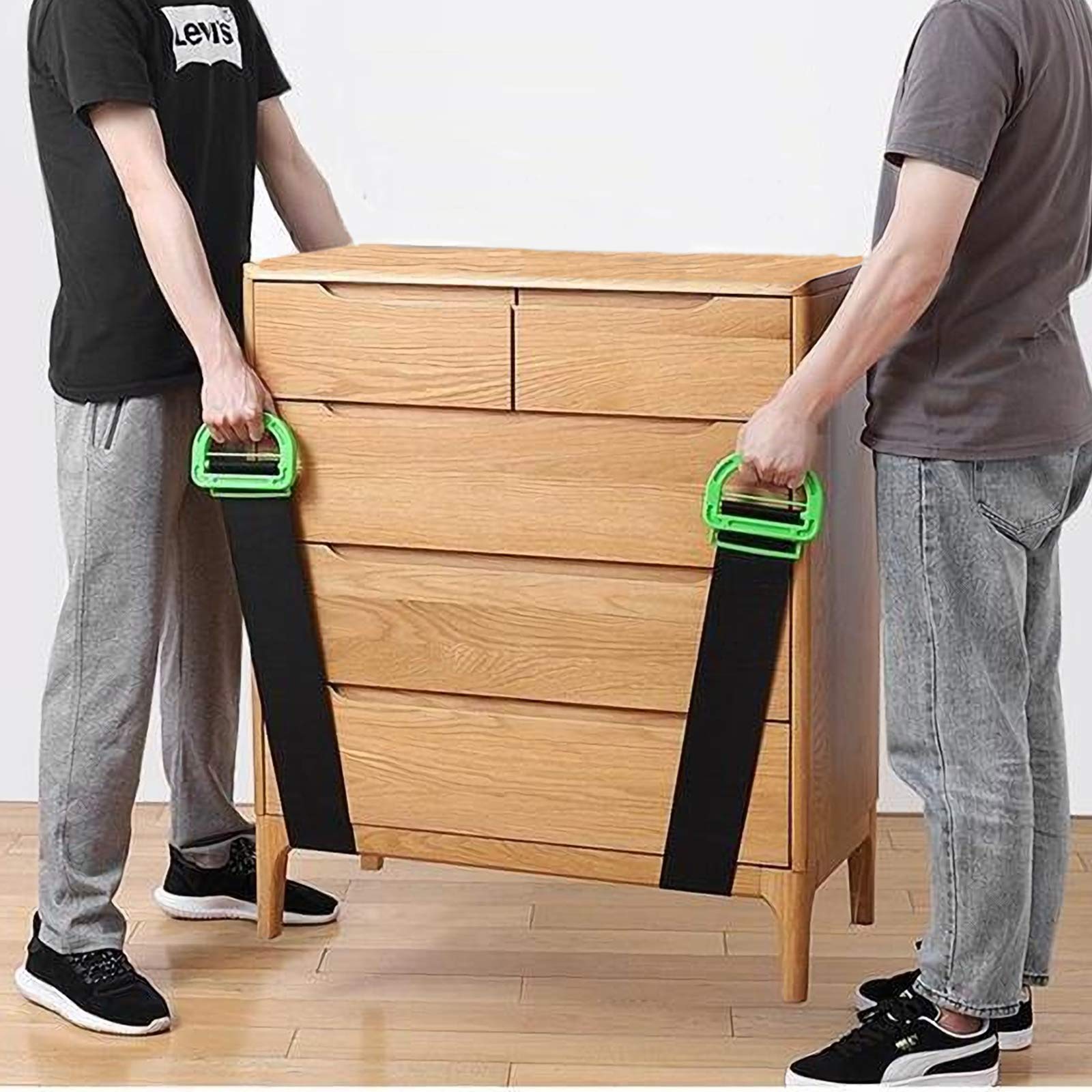 Team of movers carrying a sofa